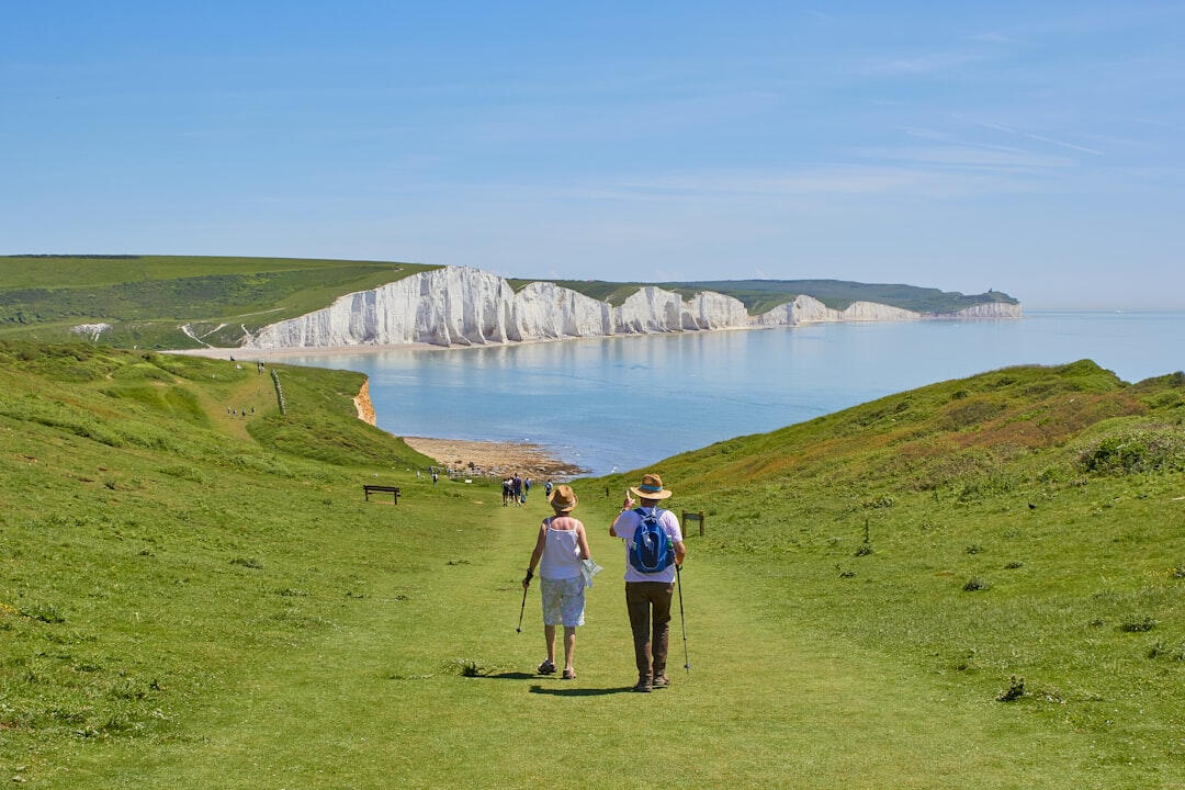 Old Healthy Pain Free Retired Couple An old couple walking towards the Seven Sisters
